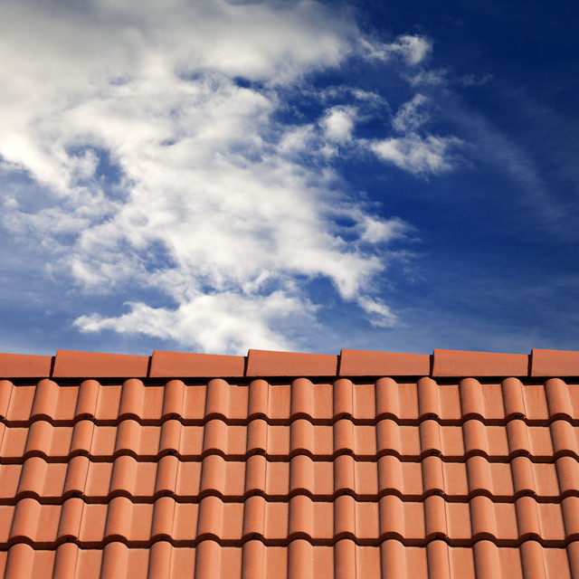 A Tile Roof Against a Blue Sky.