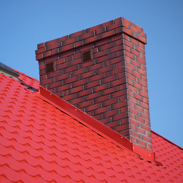 A Chimney with Red Roof Flashing.