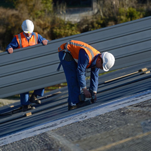 Roofers Install a Commercial Roof