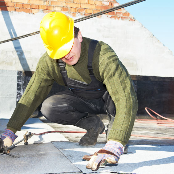 A Roofer Making an Inspection.