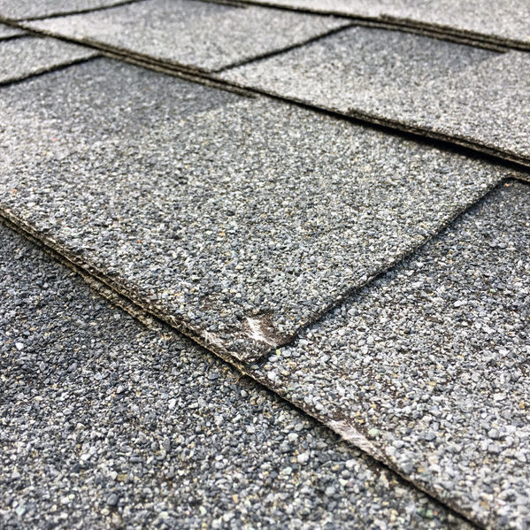 Some Shingles Damaged by the Wind.