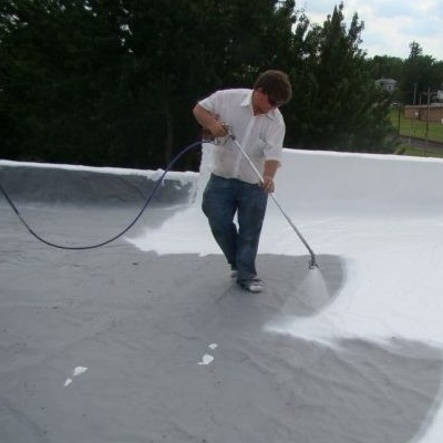 A Roofer Applies an Acrylic Roof Coating.