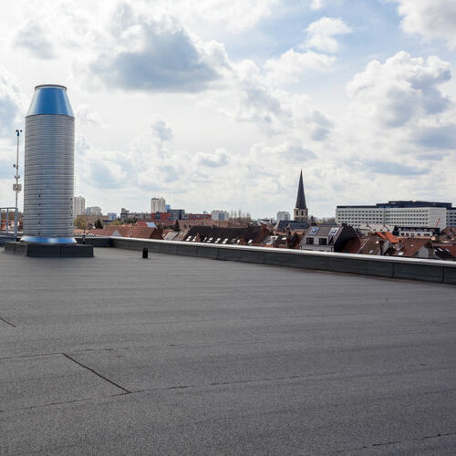 inox Chimney on the flat roof in the city