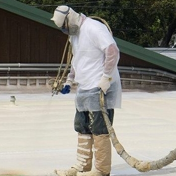 A Roofer Sprays on Foam Roofing